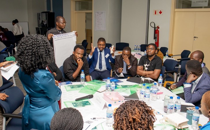 Left: Partners during a co-creation session at the research consortium, Right- Chiku Mtegha from the Lilongwe University of Agriculture and Natural Resources and COHESA project – Malawi county lead addressing participants at the meeting. 
